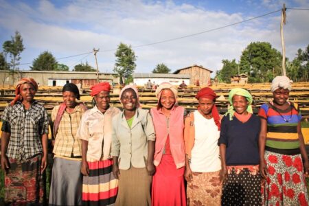 Coffee farmers standing in a line for the photo